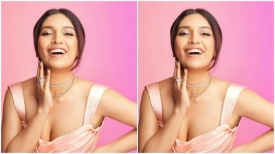 Styled by fashion stylist Pranita Shetty, Bhumi wore her tresses open into a messy bun and left a few strands open around her face. (Instagram/@bhumipednekar)