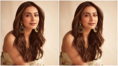 Rakul Preet accessorised her look to perfection with golden jhumkas and a gold bangle from the shelves of Abhilasha Pret Jewellery and Aulerth. (Instagram/@rakulpreet)