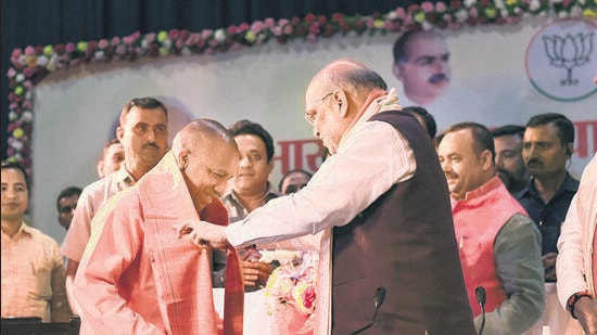 Union home minister Amit Shah with UP CM-designate Yogi Adityanath at Lok Bhawan in Lucknow on Thursday. (PTI)