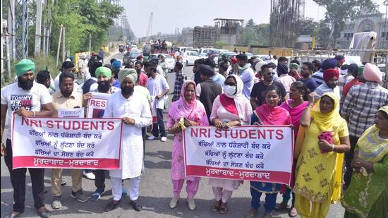 Relatives of NRI student of GADVASU block Ferozepur road after holding a protest dharna against authorities in Ludhiana on March 24, 2022. (Gurpreet Singh/HT)
