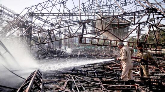 A firefighter douses the blaze in the Rohini on Thursday. (PTI) A firefighter douses the blaze in the Rohini on Thursday. (PTI)