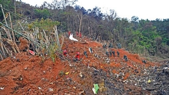 Rescue workers search for the black boxes at the plane crash site in southwestern China's Guangxi Zhuang Autonomous Region (Zhou Hua/Xinhua via AP)(AP)