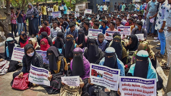 Students of Wakf Board College staged a protest against the Karnataka high court order upholding the hijab ban in educational institutes. (PTI) Students of Wakf Board College staged a protest against the Karnataka high court order upholding the hijab ban in educational institutes. (PTI)