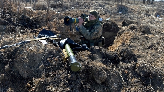 A serviceman of Ukrainian military forces holds a FGM-148 Javelin, an American-made portable anti-tank missile.(AFP)