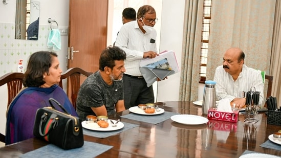 Bommai pictured with Shivrajkumar and his wife Geeta 