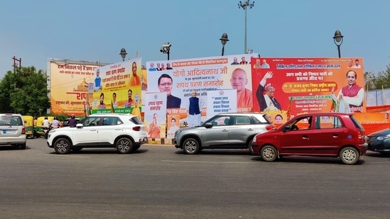 Hoardings are installed as part of preparations of the oath-taking ceremony of BJP leader Yogi Adityanath as Uttar Pradesh chief minister for the second time, which is scheduled on March 25. (ANI Photo)(ANI)