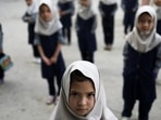 Afghan girls look on at a school in Kabul, Afghanistan, September 18, 2021. (REUTERS/ Picture provided by a third party: TPX IMAGES OF THE DAY)