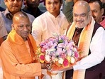 Yogi Adityanath being felicitated by Union Home Minister Amit Shah during the BJP Legislature Party meeting, in Lucknow on Thursday. (ANI) (Pramod Adhikari) Yogi Adityanath being felicitated by Union Home Minister Amit Shah during the BJP Legislature Party meeting, in Lucknow on Thursday. (ANI) (Pramod Adhikari)