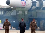 This picture shows North Korean leader Kim Jong Un (C) walking near what state media report says a new type inter-continental ballistic missile (ICBM). This picture shows North Korean leader Kim Jong Un (C) walking near what state media report says a new type inter-continental ballistic missile (ICBM).