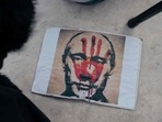 A placard depicting Russian President Vladimir Putin during a rally against Russia's military invasion in Ukraine in Belgrade, March 20, 2022.&nbsp;