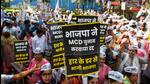 Aam Aadmi Party (AAP) supporters protest against the BJP for allegedly postponing the Municipal Corporations of Delhi (MCD) elections, on March 14. (Amal KS/HT photo) Aam Aadmi Party (AAP) supporters protest against the BJP for allegedly postponing the Municipal Corporations of Delhi (MCD) elections, on March 14. (Amal KS/HT photo)