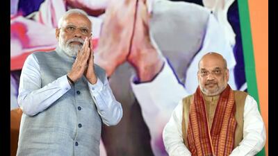 Prime Minister Narendra Modi with Union home minister Amit Shah in New Delhi, March 10, 2022 (PTI)