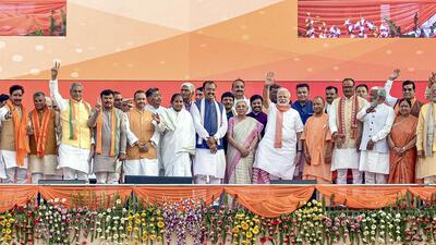 Prime Minister Narendra Modi with Uttar Pradesh chief minister Yogi Adityanath and others at the swearing-in ceremony at Atal Bihari Ekana Stadium in Lucknow on Friday. (PTI)