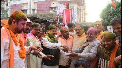 BJP workers celebrating in Prayagraj on Friday. (HT PHOTO)