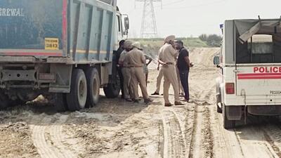 A police team in process to impound the vehicles of accused found to be involved in illegal sand mining, in Ludhiana on Friday. (HT Photo) A police team in process to impound the vehicles of accused found to be involved in illegal sand mining, in Ludhiana on Friday. (HT Photo)