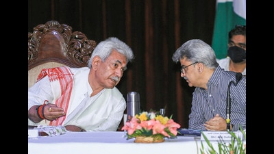Jammu and Kashmir Lt governor Manoj Sinha talks to additional chief secretary Atal Dulloo during a press conference at the Convention Centre in Jammu on Friday. (PTI)