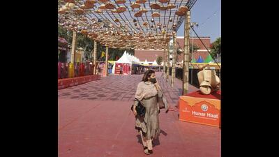 A visitor taking the round of Hunar Haat fair at Parade Ground, Sector 17, in Chandigarh on a hot Friday afternoon. (Keshav Singh/HT)