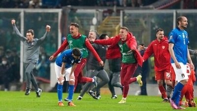 North Macedonia players celebrate as Italy players react after their team's elimination at the end of the World Cup qualifying play-off match in Palermo, Italy. (AP) North Macedonia players celebrate as Italy players react after their team's elimination at the end of the World Cup qualifying play-off match in Palermo, Italy. (AP)