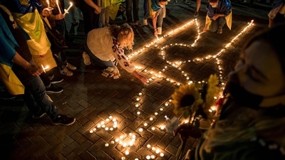 Members of the Ukrainian community take part in a vigil to protest against the Russian invasion of Ukraine, in Santiago. (AFP) Members of the Ukrainian community take part in a vigil to protest against the Russian invasion of Ukraine, in Santiago. (AFP)