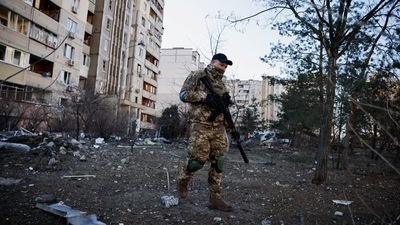 A member of the Ukrainian military surveys an area next to a residential building hit by an intercepted missile | Representational image (REUTERS/Thomas Peter) (REUTERS)