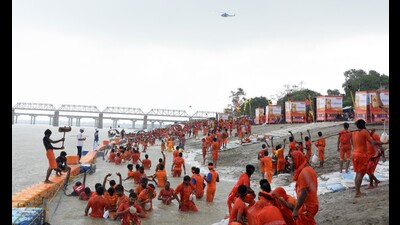 A group of Kanwariyas busy collecting sacred water from the Ganga at Dashashwamedh Ghat. (HT FILE PHOTO) A group of Kanwariyas busy collecting sacred water from the Ganga at Dashashwamedh Ghat. (HT FILE PHOTO)