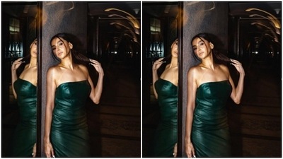 Shibani played muse to the fashion designer house Deme and picked a leather emerald green dress for the photoshoot. (Instagram/@shibanidandekar)