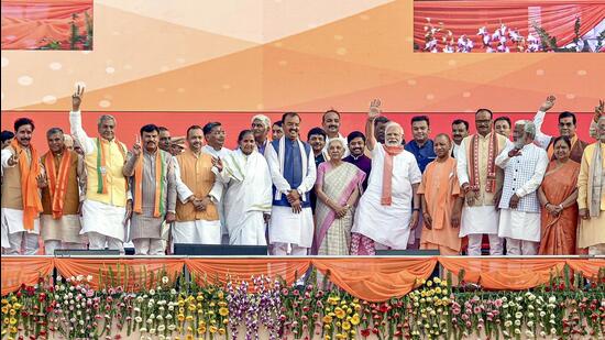 Prime Minister Narendra Modi with Uttar Pradesh chief minister Yogi Adityanath and others at the swearing-in ceremony at Atal Bihari Ekana Stadium in Lucknow on Friday. (PTI)