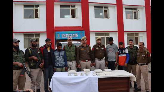 The men caught while allegedly smuggling heroin along LoC in Poonch in police custody.