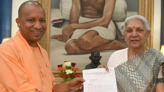 Yogi Adityanath calls on Uttar Pradesh governor Anandiben Patel after he was elected leader of the BJP legislative party. (HT Photo)