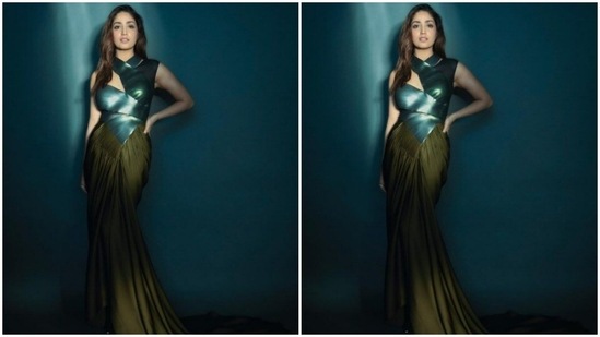Yami’s gown came with emerald green metallic wrap-around details above the waist. Below the waist, the gown cascaded to a moss green satin skirt with flowy details and pleats.(Instagram/@yamigautam)