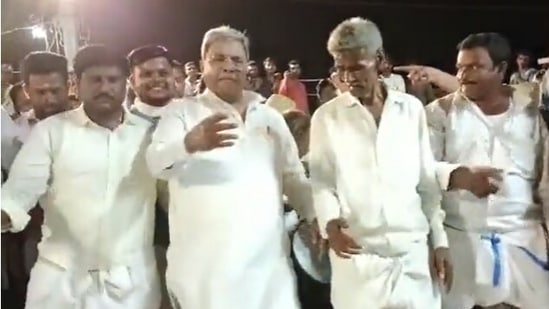 Former CM Siddaramaiah performing a folk dance at his native village of Siddaramana Hundi in Mysuru.