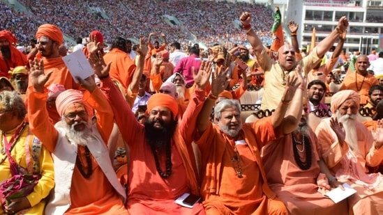 Sadhus at the swearing-in ceremony of Yogi Adityanath at Lucknow's Ekana Stadium on Friday, March 25, 2022. (Photo by Deepak Gupta/Hindustan Times)