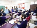 A file photo of Delhi chief minister Arvind Kejriwal, deputy CM Manish Sisodia and health minister Satyendar Jain interact with students at Rajkiya Kanya Vidyalaya.(ANI) A file photo of Delhi chief minister Arvind Kejriwal, deputy CM Manish Sisodia and health minister Satyendar Jain interact with students at Rajkiya Kanya Vidyalaya.(ANI)