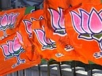 A Bharatiya Janta Party worker erecting BJP flags.(Nitin Kanotra / Hindustan Times) A Bharatiya Janta Party worker erecting BJP flags.(Nitin Kanotra / Hindustan Times)