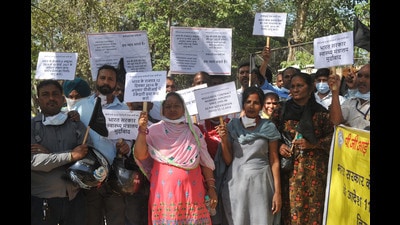 Members of the PGI Contract Workers’ Union holding a protest on Saturday to press for their demand of salaries on par with regular employees. (Ravi Kumar/HT)