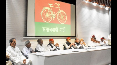 SP President Akhilesh Yadav with newly elected MLAs of the party during a media briefing. (Agency)