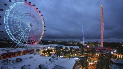 ICON Park attractions, The Wheel, left, Orlando SlingShot, middle, and Orlando FreeFall, right, are shown in Orlando, Fla., on Thursday. The boy fell from the Orlando Free Fall ride, which opened late last year. ((Stephen M. Dowell /Orlando Sentinel via AP))