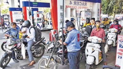 Motorcyclists wait in queues to get their vehicles filled with fuel, at a petrol pump in Navi Mumbai. (PTI file)