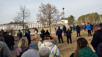 Military troops with armoured vehicles stand guard as demonstrators protest amid Russia's invasion of Ukraine, in Slavutych, Kyiv Oblast, Ukraine in this picture obtained by Reuters from social media on March 26, 2022.&nbsp; (via REUTERS)