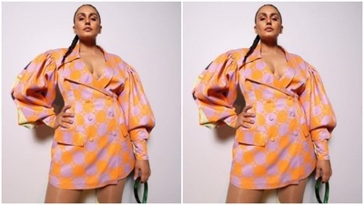 Huma’s short dress came in shades of neon orange and grey. The blazer-styled short dress came with dramatic full sleeves and midriff-baring detail. (Instagram/@iamhumaq)