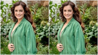 Dia paired a grey T-shirt with a green striped cotton shirt and a pair of comfy cotton trousers of the same print. (Instagram/@diamirzaofficial)