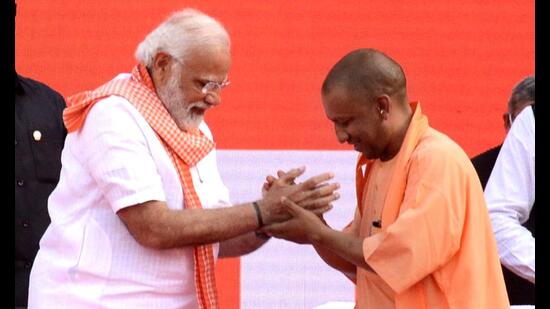 Prime Minister Narendra Modi with Bharatiya Janata Party (BJP) leader Yogi Adityanath during his oath-taking ceremony as chief minister of Uttar Pradesh for the second consecutive term, Lucknow, March 25, 2022 (ANI)