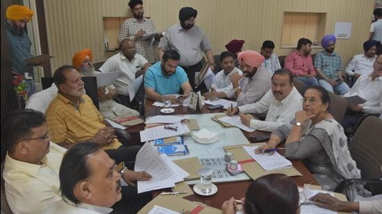 Ludhiana mayor Balkar Sandhu and MC councillors during an all-party meeting at his camp office on Saturday. (Gurpreet Singh/HT)