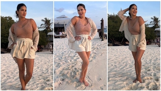 Sunny Leone gives major summer vibes in a beige tank top, linen shorts and an oversized checkered shirt.