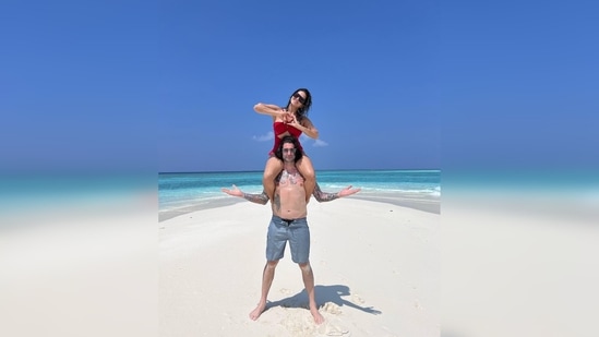 Earlier, Sunny Leone posted a picture with her husband Daniel Weber from an island and wrote, "On a island stuck with this one!! Not so bad!! Lol."(Instagram/@sunnyleone)