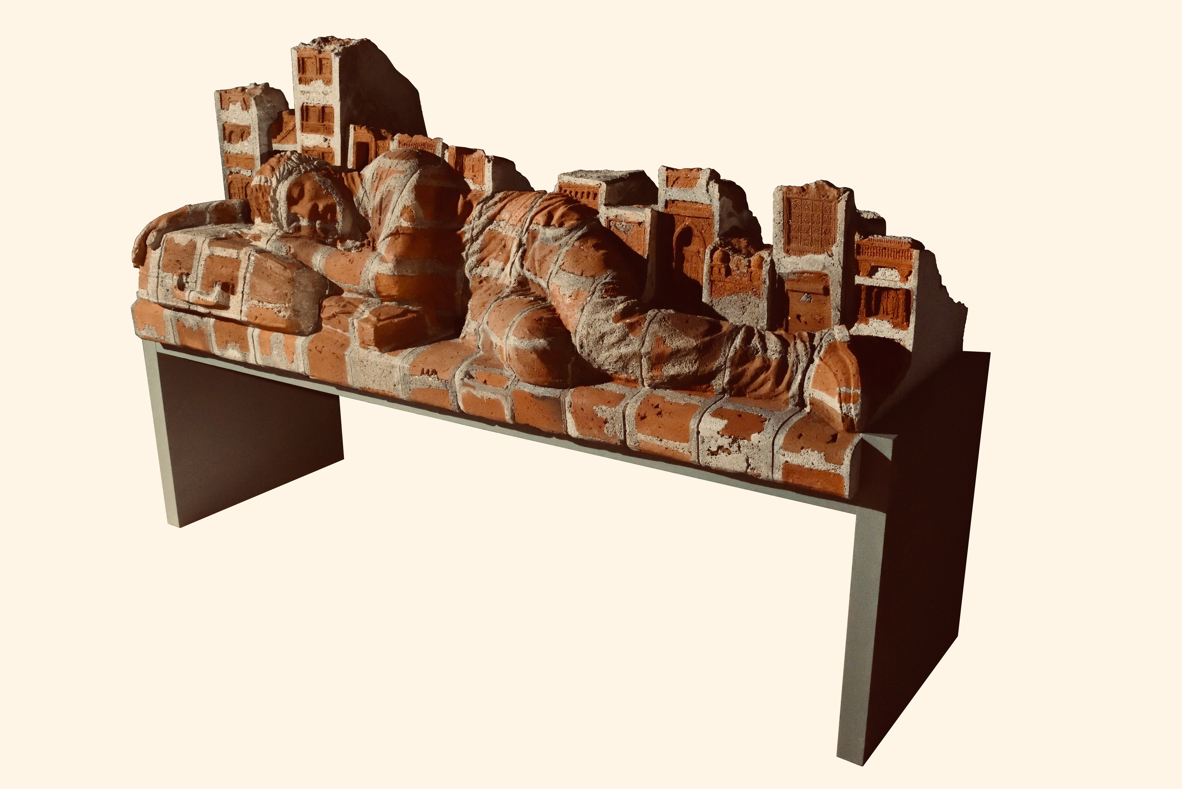 Girjesh Kumar Singh’s brick and mortar work, In Transit, shows a man on a railway bench. Girjesh Kumar Singh’s brick and mortar work, In Transit, shows a man on a railway bench.