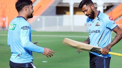 Rashid Khan (L) and Hardik Pandya for Gujarat Titans (PTI) Rashid Khan (L) and Hardik Pandya for Gujarat Titans (PTI)