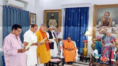 Uttar Pradesh governor Anandiben Patel administers oath to Bharatiya Janata Party (BJP) MLAs as members of the panel of pro tem Speaker of Uttar Pradesh assembly in the presence of chief minister Yogi Adityanath, in Lucknow on Saturday. (ANI PHOTO)