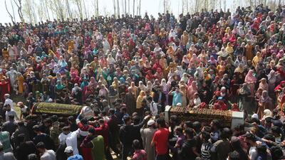 People carry the coffins of slain SPO Ishfaq Ahmad and his brother Umer Dar during their funeral procession at Chattabugh village, around 25 km from Srinagar in central Kashmir, in Budgam district, on Sunday. (Waseem Andrabi/HT photo) People carry the coffins of slain SPO Ishfaq Ahmad and his brother Umer Dar during their funeral procession at Chattabugh village, around 25 km from Srinagar in central Kashmir, in Budgam district, on Sunday. (Waseem Andrabi/HT photo)