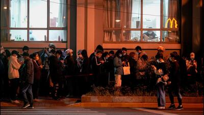 People line up near a nucleic acid testing site outside a hospital during mass testing for Covid-19 in Shanghai, China, on Sunday. (REUTERS) People line up near a nucleic acid testing site outside a hospital during mass testing for Covid-19 in Shanghai, China, on Sunday. (REUTERS)